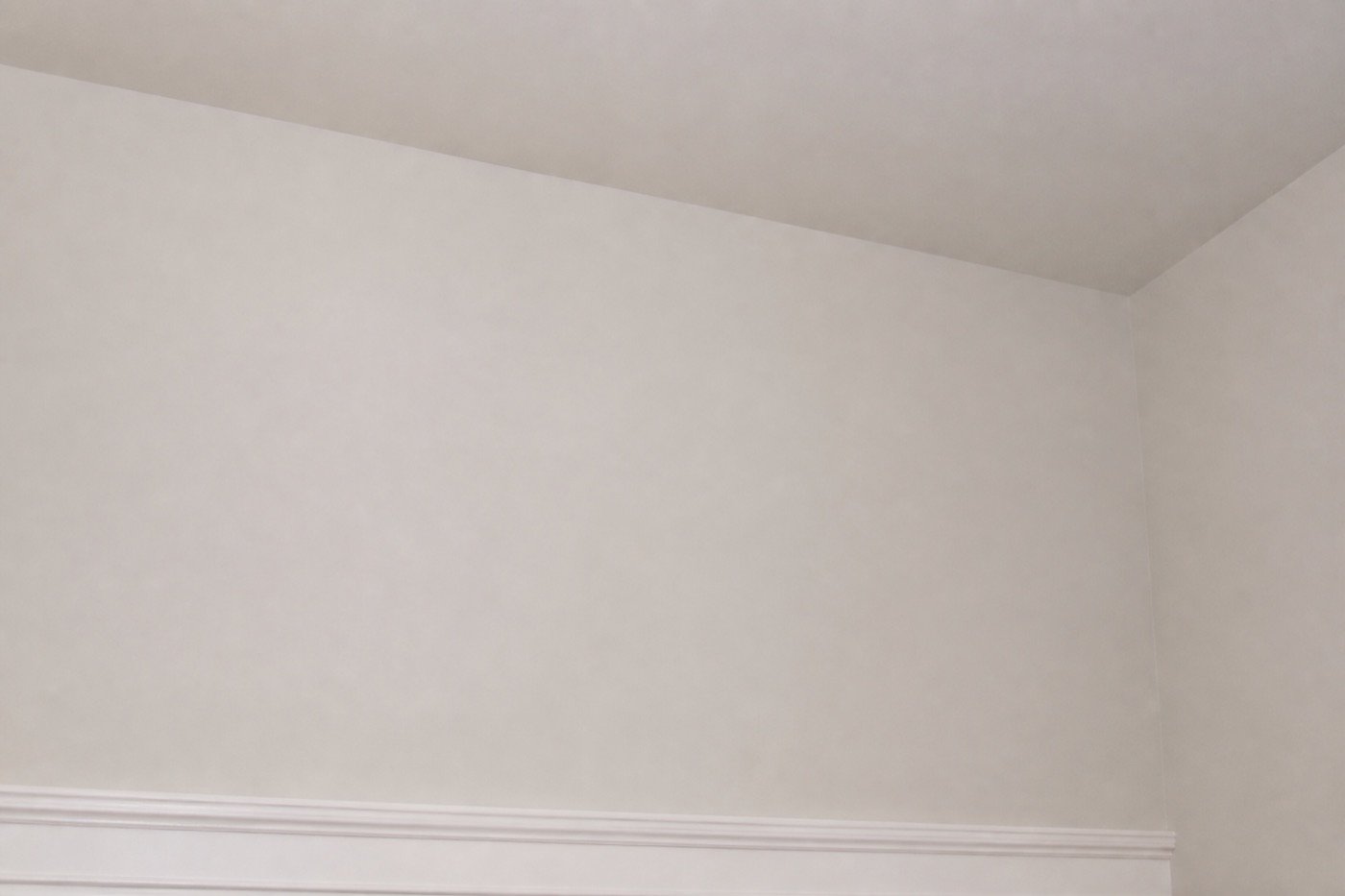 Repaired and repainted drywall with a smooth, seamless finish